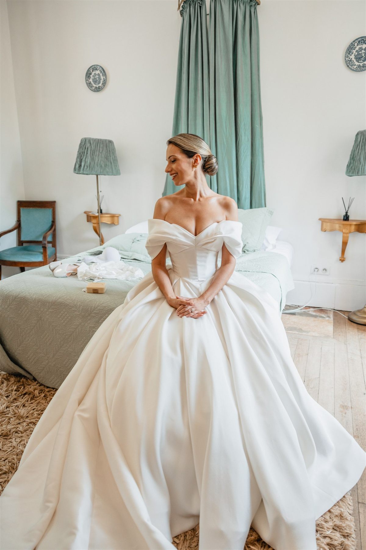Bride seated in a silk ball gown